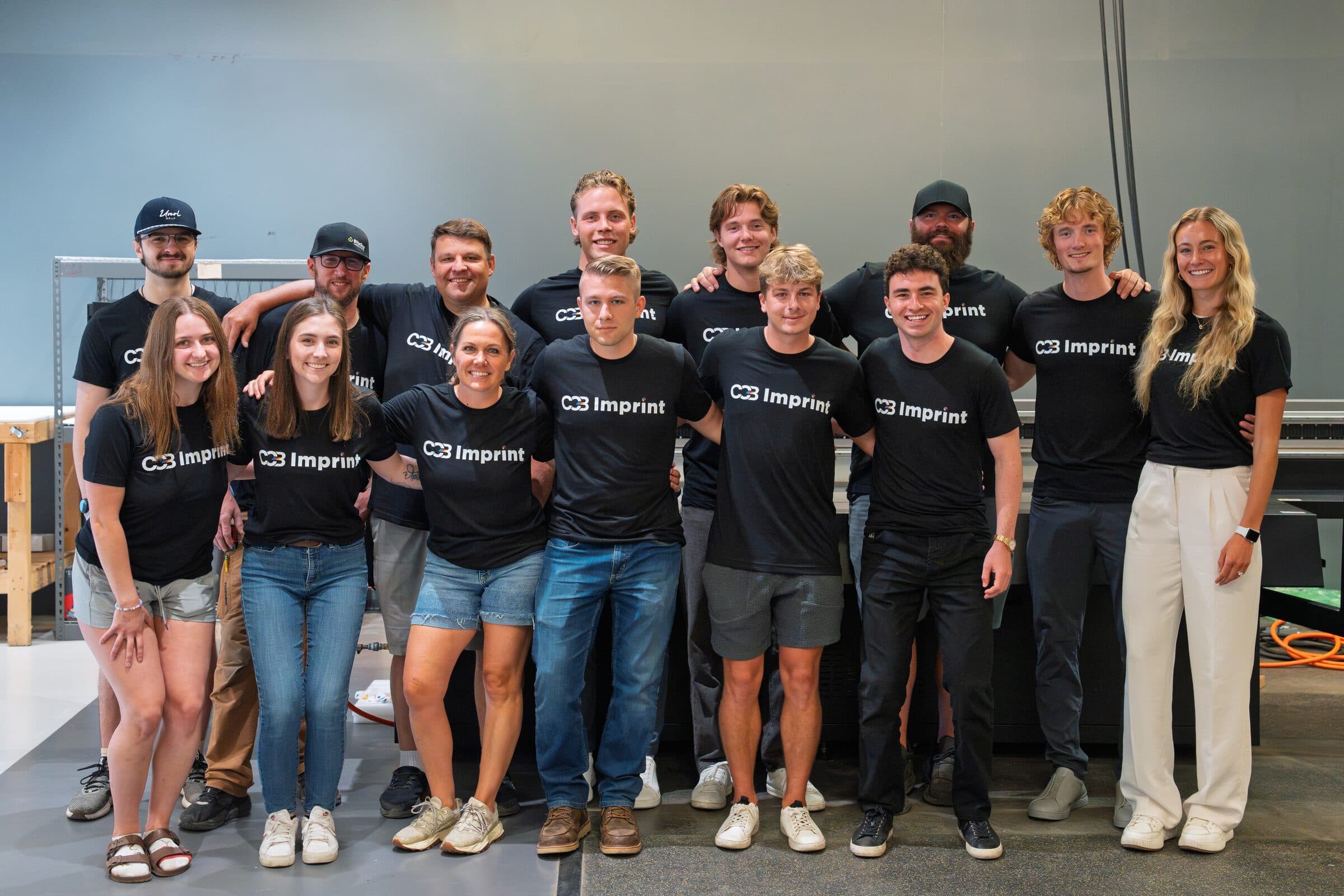 The CCB Imprint team standing together inside the production facility.